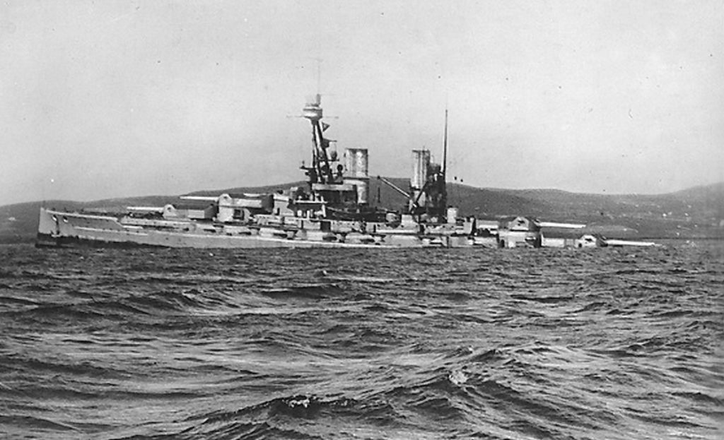 No. 2 German battleship "Bayern" sinking by the stern. Photo taken 2 p.m., 21-6-1919 "Bayern" was salvaged September 1933. This series of postcards seems to have been made by C. W. Burrows to record the scuttling of the German fleet at Scapa Flow in 1919.