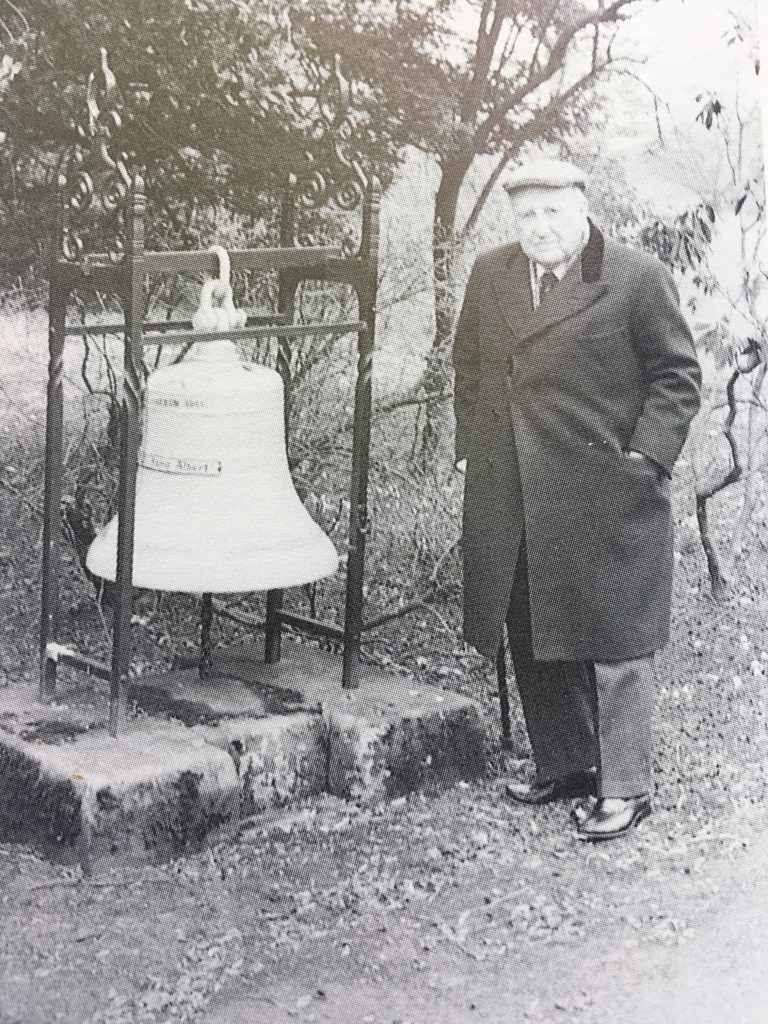 Bob McCrone seen with the salvaged bell of SMS König Albert.